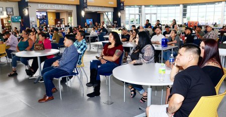 An overflow crowd of about 100 people watched the ceremony in the Student Union.